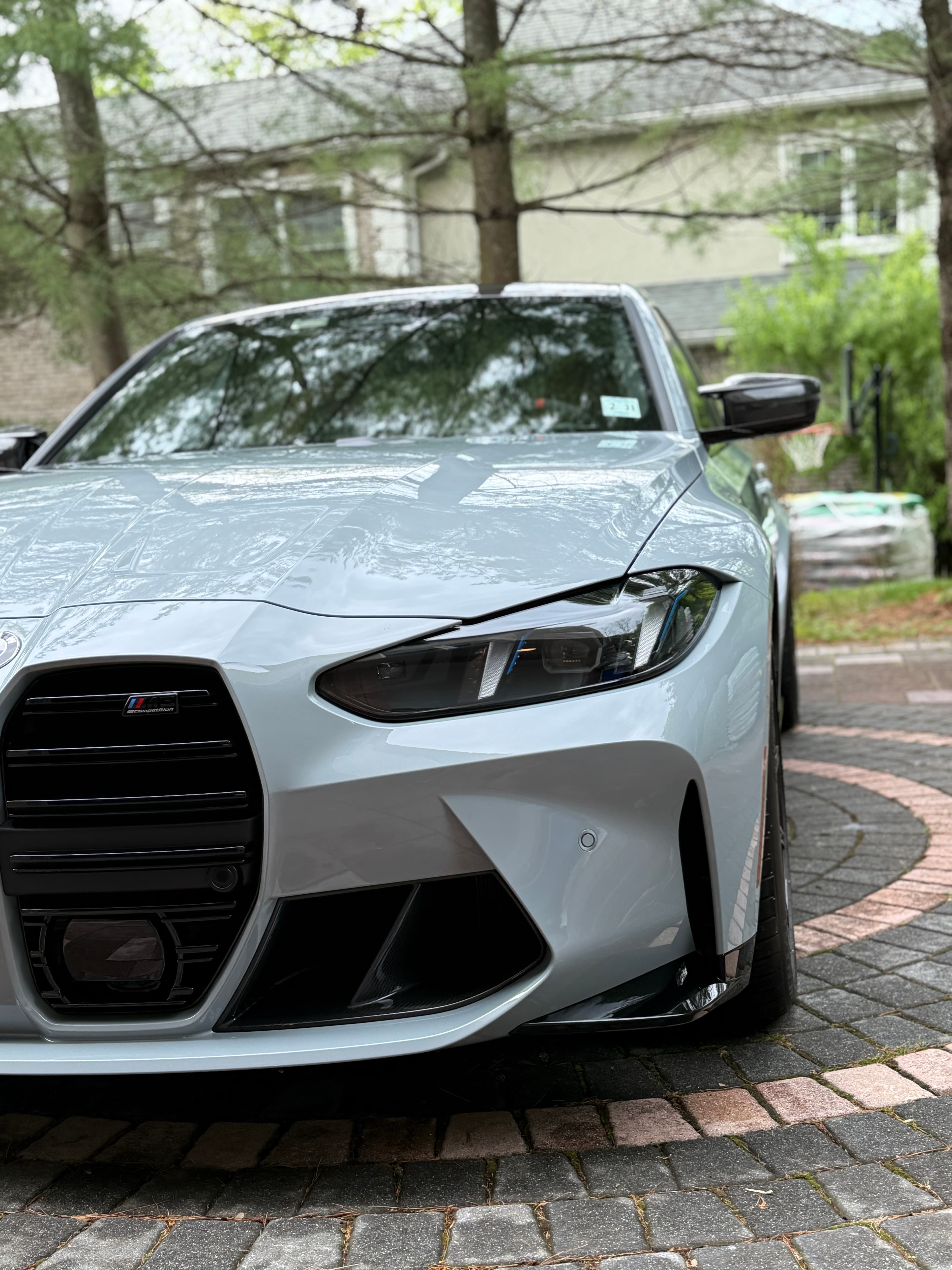 Front end of a gray BMW M4 with flawless protected paint