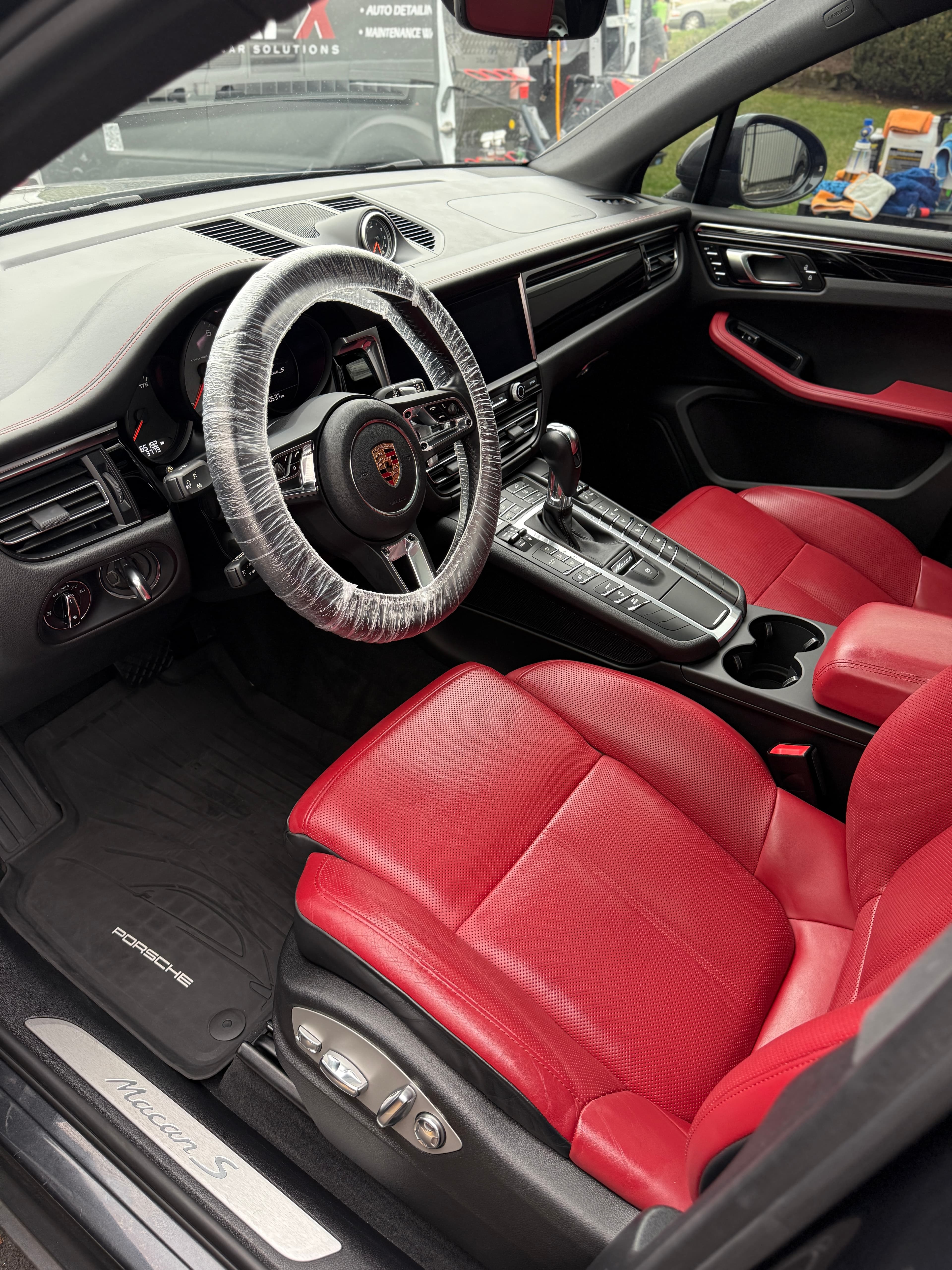 Red leather interior of a Porsche Macan S detailed in Woodcliff Lake